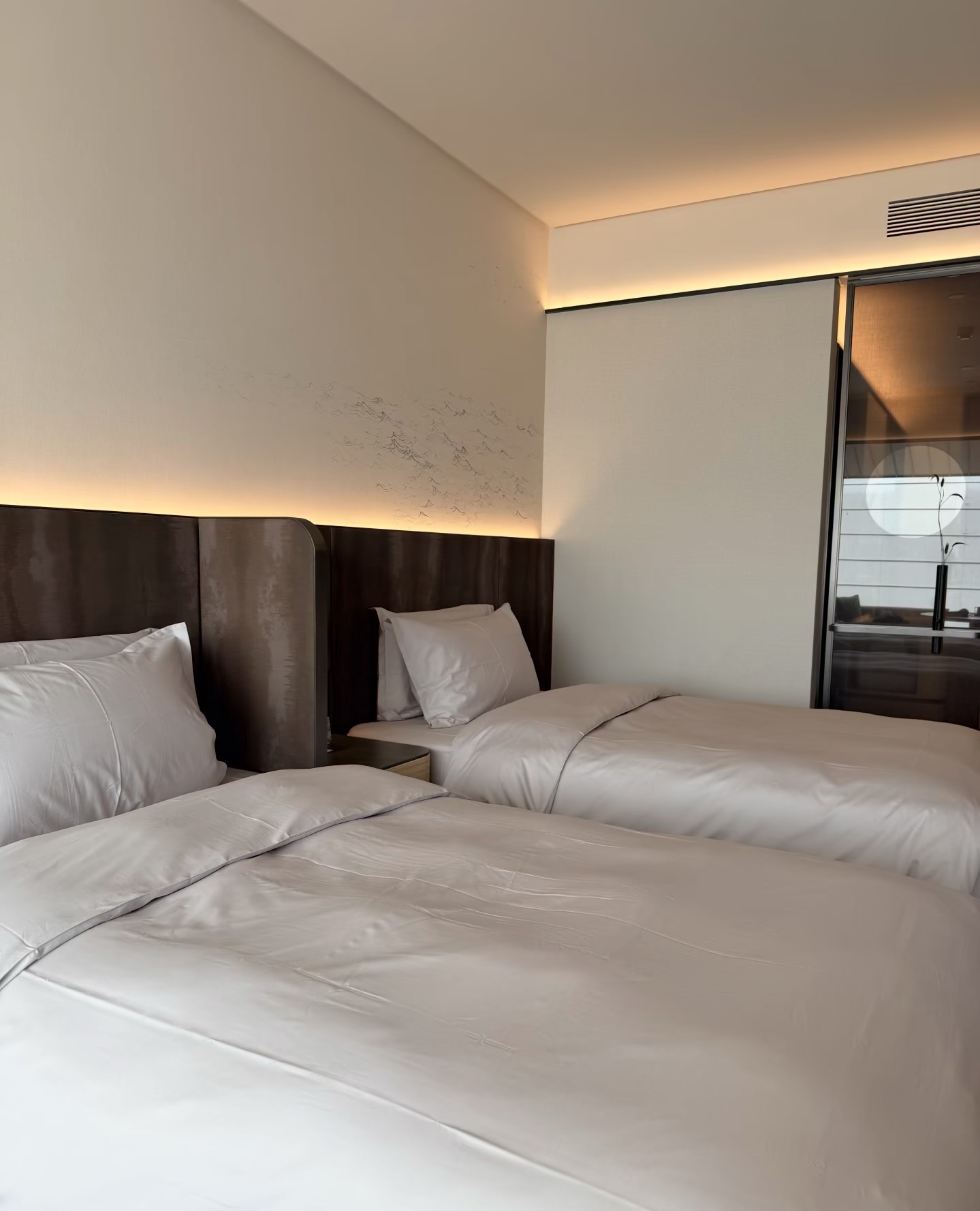 Hotel guest room with bedding and linen products